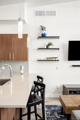 a kitchen with a dining table and chairs