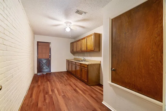 a view of kitchen with microwave and stove