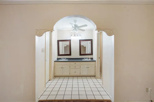 a bathroom with a sink a mirror and a vanity