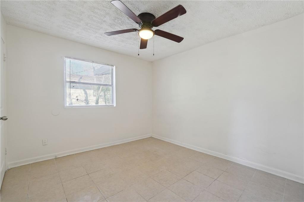 324 Brooks Avenue Southwest, Unit B Atlanta, GA 30310 - Photo 16 of 25 an empty room with a window and a fan