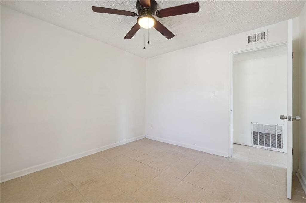 324 Brooks Avenue Southwest, Unit B Atlanta, GA 30310 - Photo 17 of 25 an empty room with chandelier fan