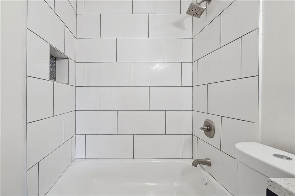 324 Brooks Avenue Southwest, Unit B Atlanta, GA 30310 - Photo 21 of 25 a bathroom with a bathtub and toilet