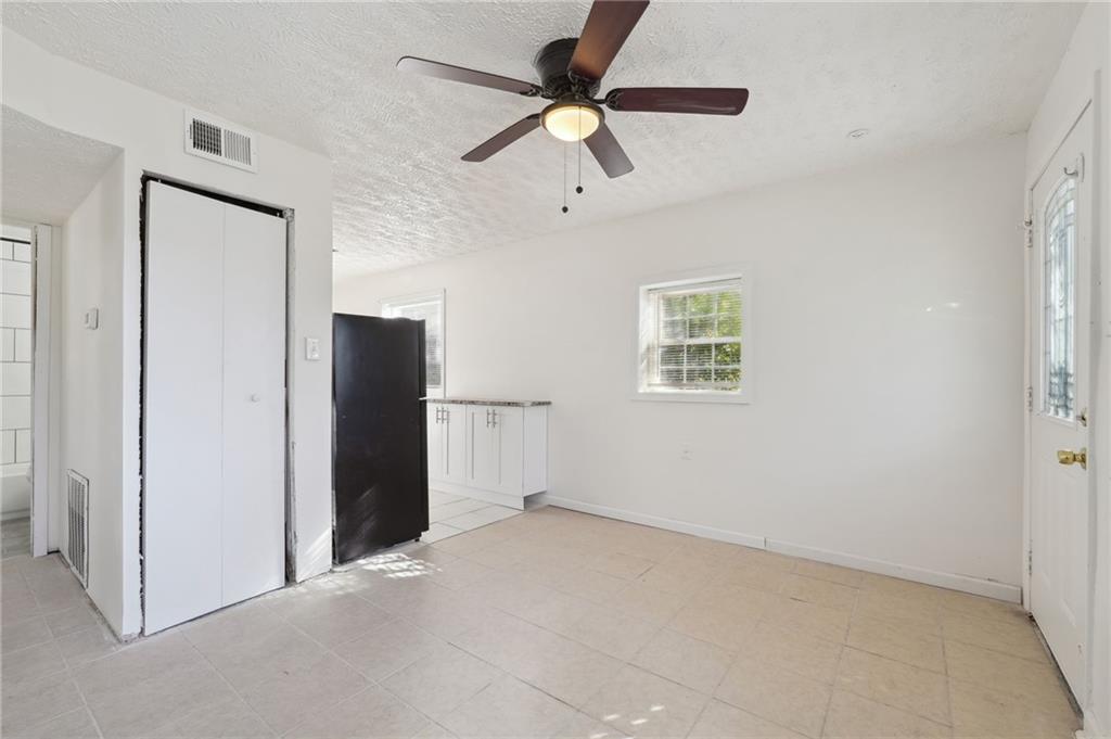 324 Brooks Avenue Southwest, Unit B Atlanta, GA 30310 - Photo 4 of 25 a view of an empty room with a ceiling fan