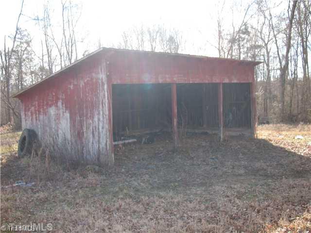 344 Edward Road Thomasville, NC 27360 - Photo 6 of 11 Exterior Front. Tractor shed