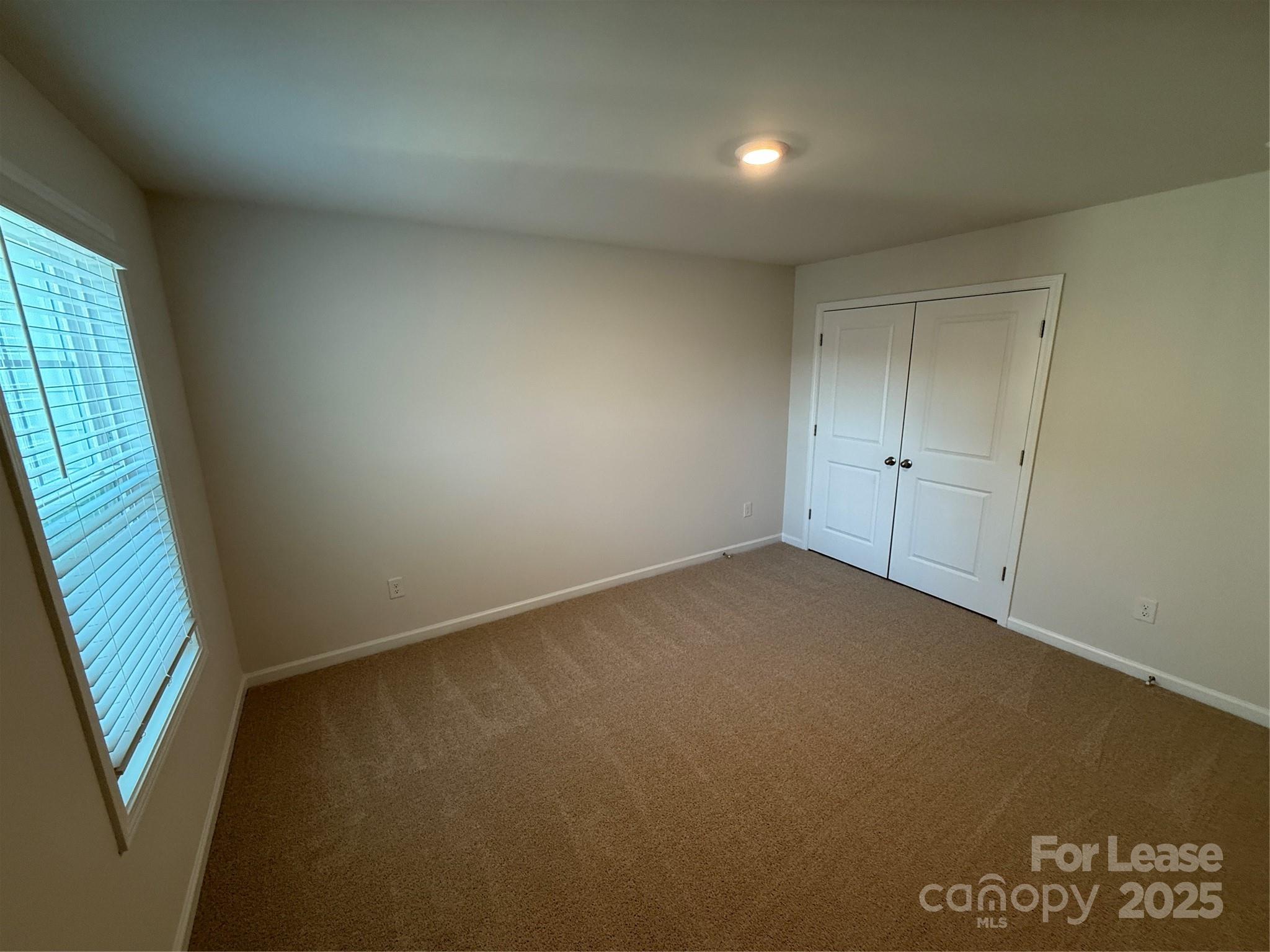 4144 Steel Way Sherrills Ford, NC 28673 - Photo 20 of 24 an empty room with windows