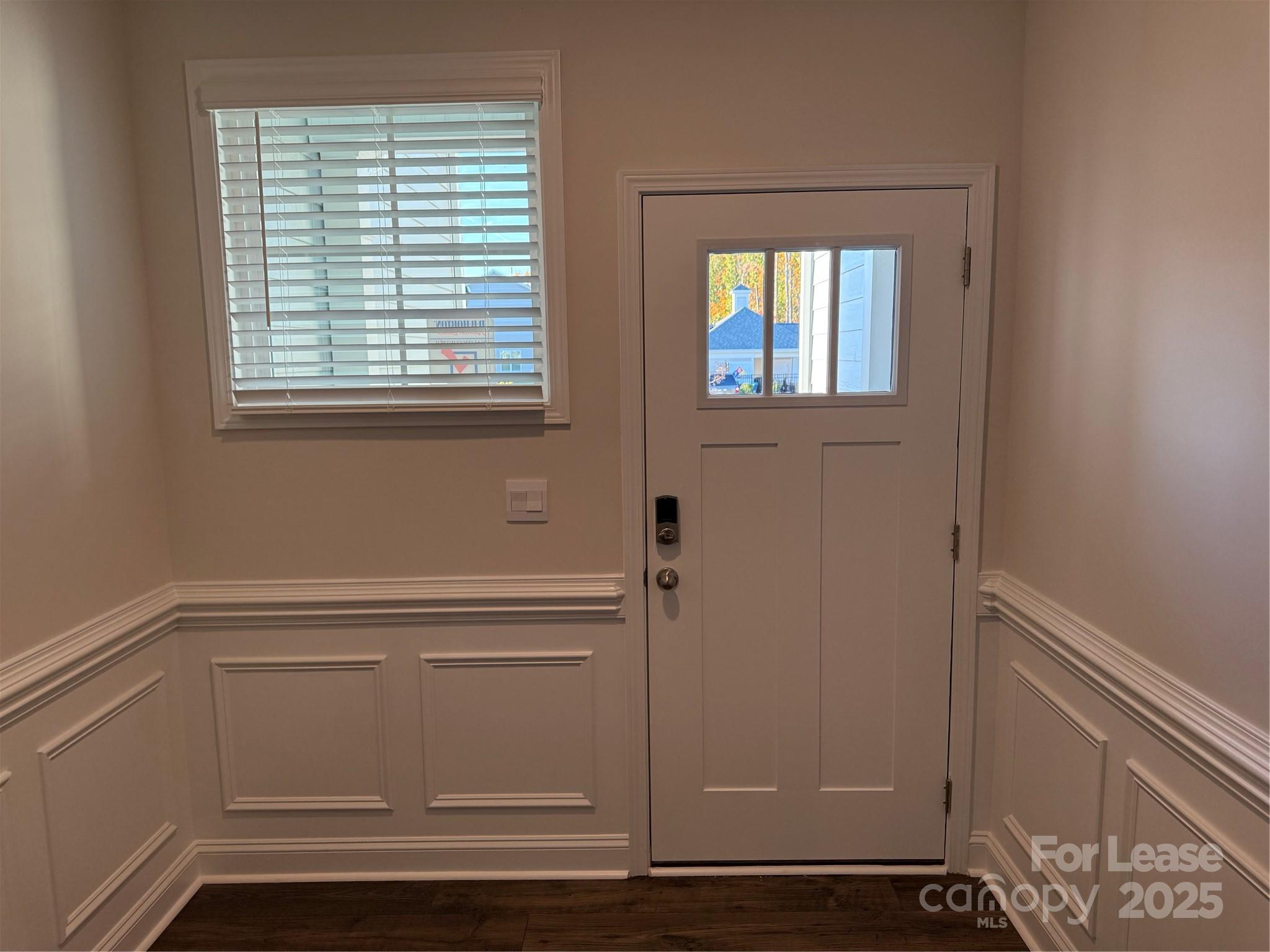 4144 Steel Way Sherrills Ford, NC 28673 - Photo 3 of 24 a view of an empty room with wooden floor and a window