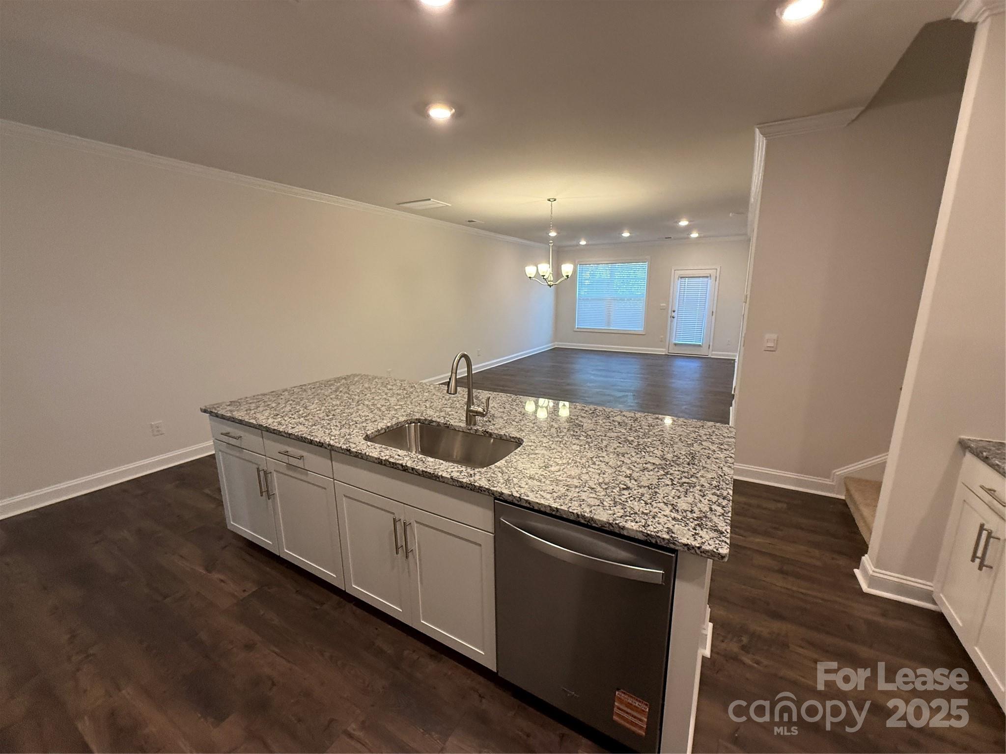 4144 Steel Way Sherrills Ford, NC 28673 - Photo 7 of 24 a kitchen with stainless steel appliances granite countertop a sink a stove and a wooden floors