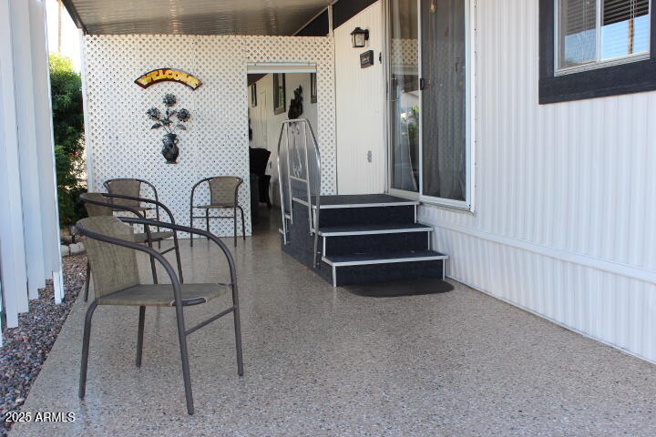 303 South Recker Road, Unit 223 Mesa, AZ 85206 - Photo 2 of 31 a view of hall way with furniture
