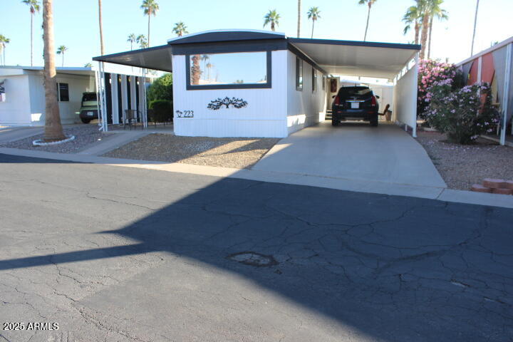303 South Recker Road, Unit 223 Mesa, AZ 85206 - Photo 30 of 31 a view of a car park in front of a building