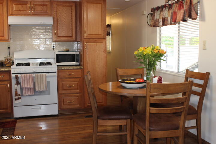 303 South Recker Road, Unit 223 Mesa, AZ 85206 - Photo 7 of 31 a dining room with furniture and window