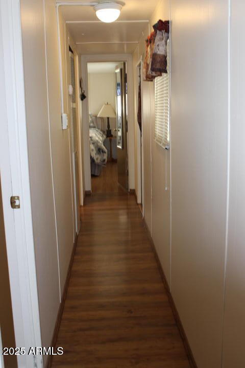 303 South Recker Road, Unit 223 Mesa, AZ 85206 - Photo 9 of 31 a view of a hallway with wooden floor and staircase