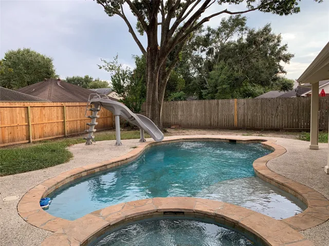 a view of a backyard with a small cabin