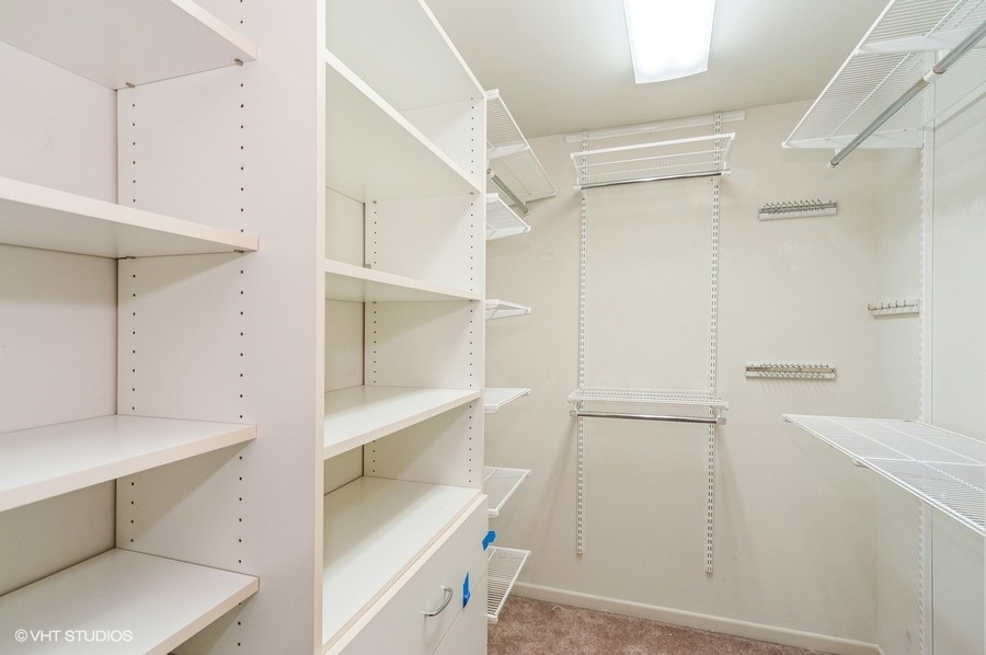 2021 Wright Boulevard Buffalo Grove, IL 60089 - Photo 17 of 29 a view of an empty walk in closet