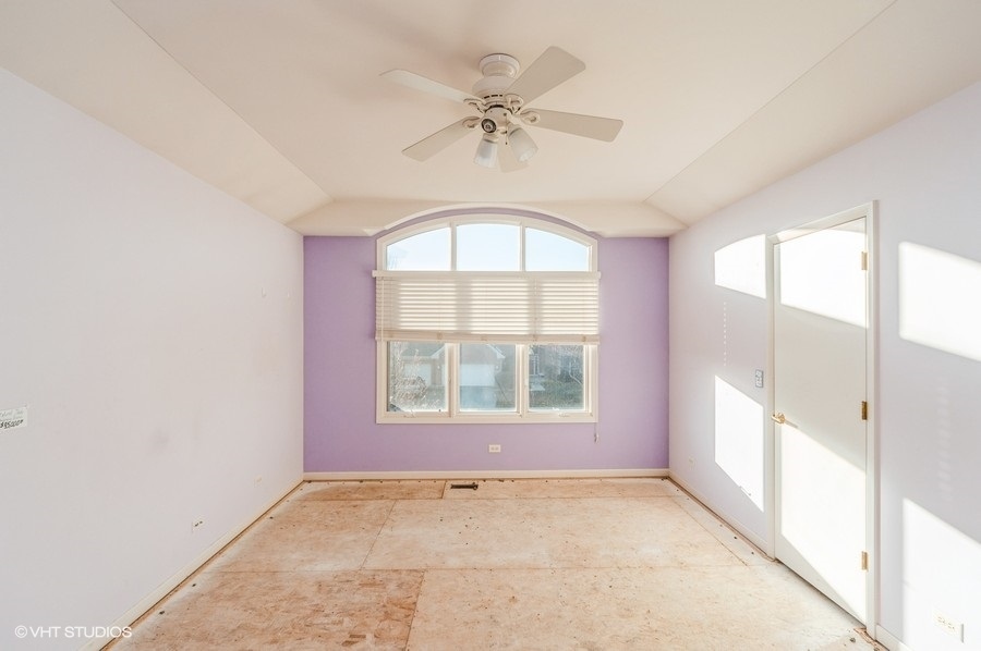 2021 Wright Boulevard Buffalo Grove, IL 60089 - Photo 23 of 29 an empty room with a window and a fan