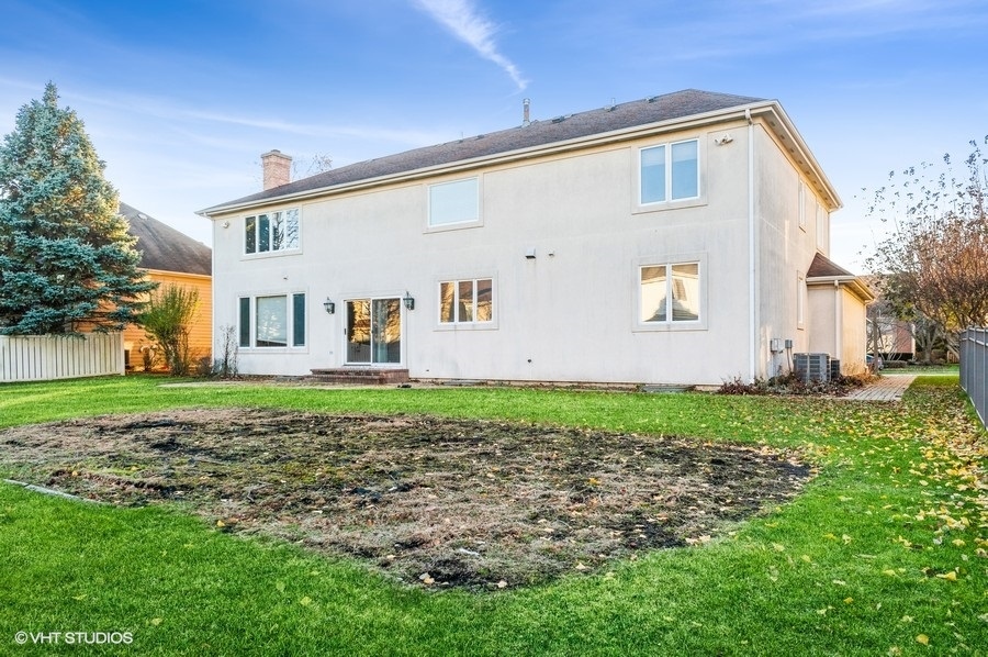 2021 Wright Boulevard Buffalo Grove, IL 60089 - Photo 29 of 29 a front view of a house with a yard