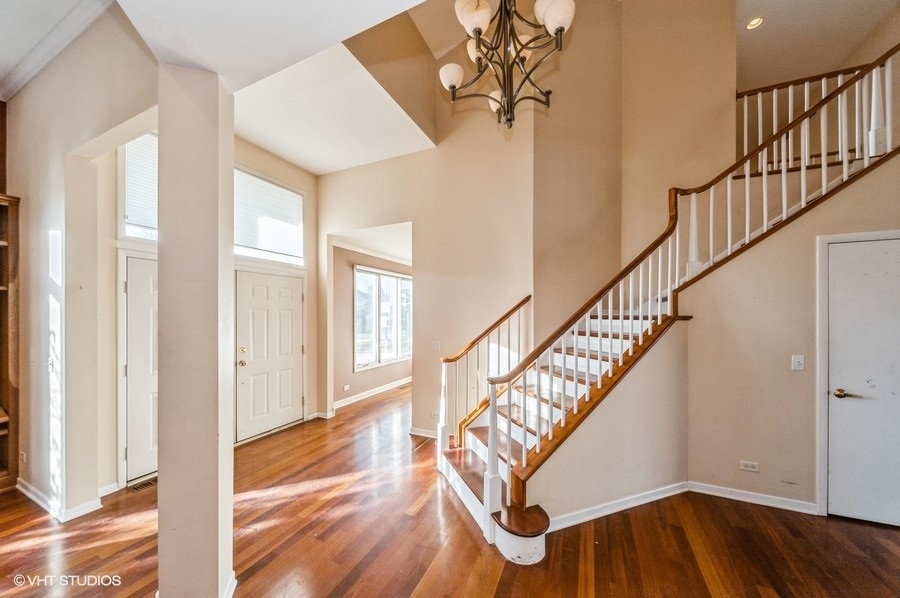 2021 Wright Boulevard Buffalo Grove, IL 60089 - Photo 3 of 29 a view of entryway with wooden floor and stairs