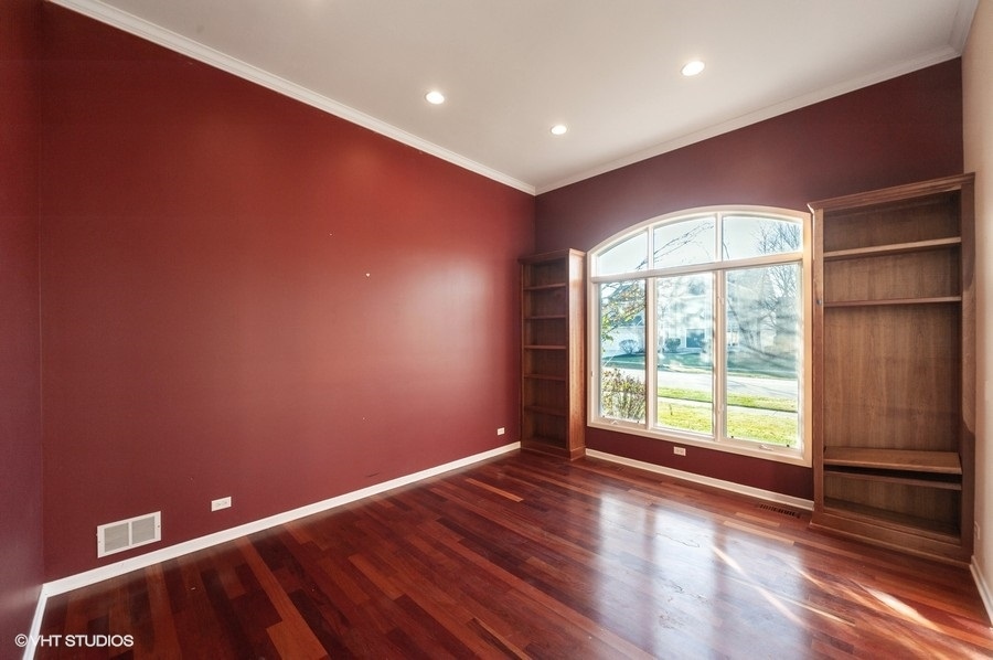 2021 Wright Boulevard Buffalo Grove, IL 60089 - Photo 6 of 29 a view of empty room with wooden floor and fan