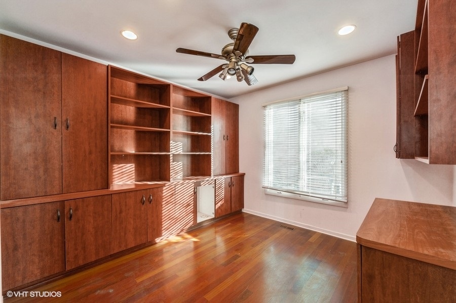 2021 Wright Boulevard Buffalo Grove, IL 60089 - Photo 7 of 29 a view of an empty room with a window and a kitchen