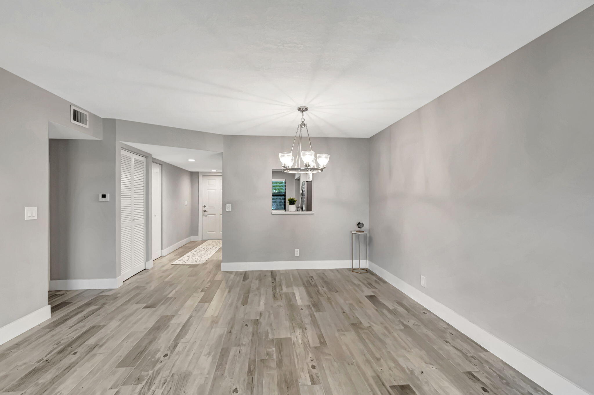 2890 Southwest 22nd Circle, Unit 241D Delray Beach, FL 33445 - Photo 12 of 34 Open Living and Dining Room