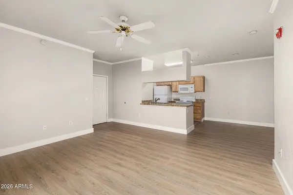 a view of kitchen with wooden floor and window