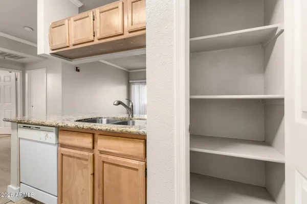 a view of cabinets and window