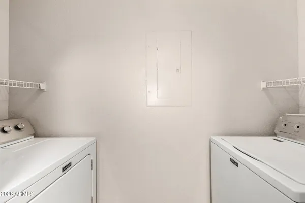 a utility room with dryer and washer