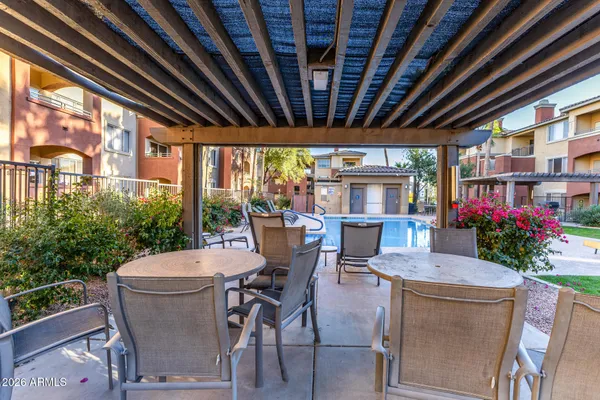 a outdoor dining space with furniture and garden view