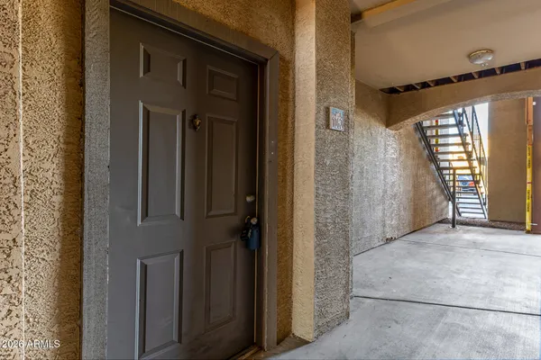 a view of a front door and wooden floor