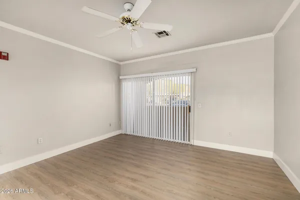 a view of an empty room with a window