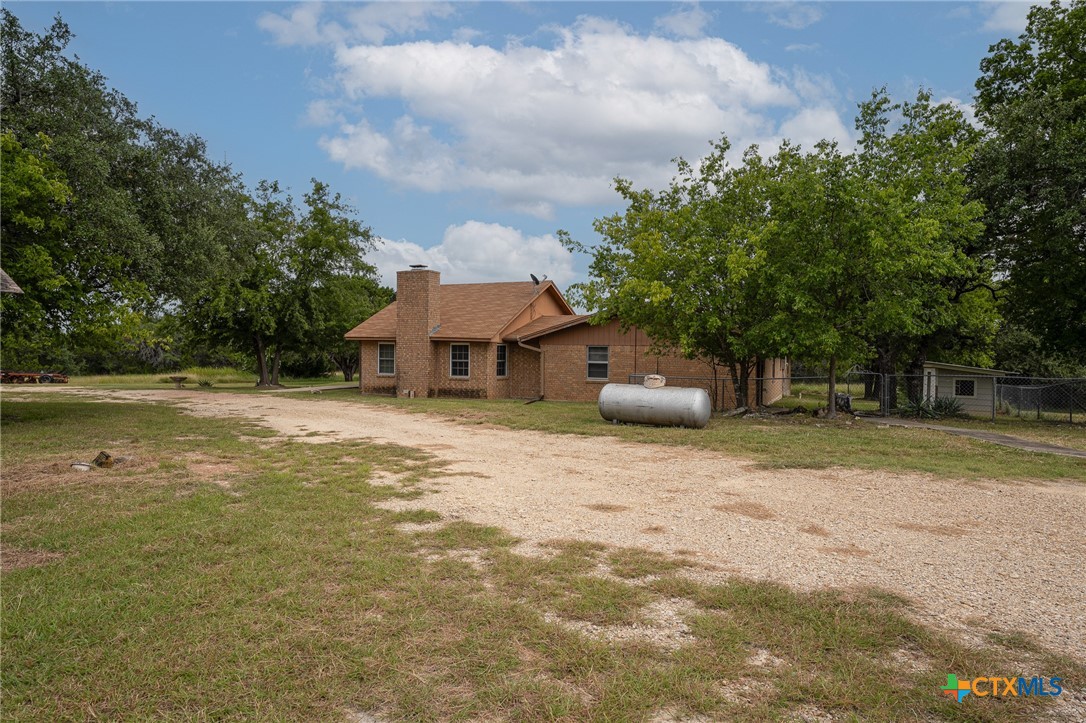 23168 Wolfridge Road Killeen, TX 76549 - Photo 3 of 42 a front view of a house with a yard and a garage