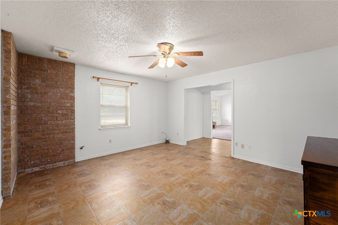 23168 Wolfridge Road Killeen, TX 76549 - Photo 9 of 42 a view of empty room with ceiling fan