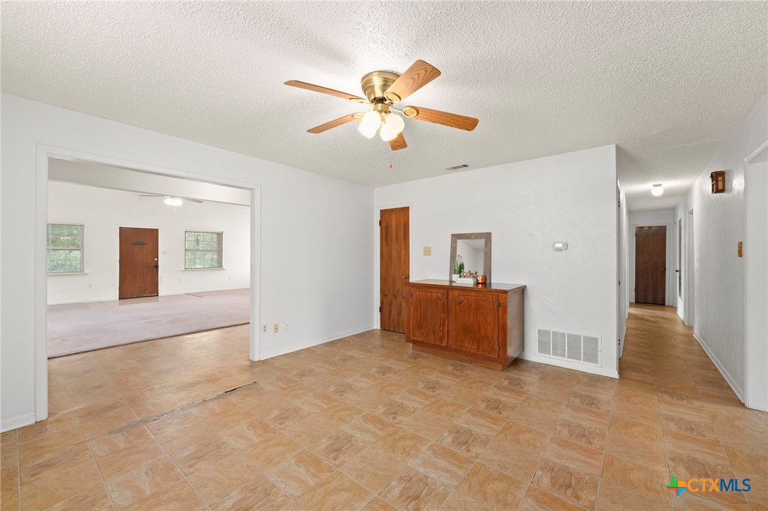 23168 Wolfridge Road Killeen, TX 76549 - Photo 10 of 42 a view of livingroom with hardwood floor and a ceiling fan