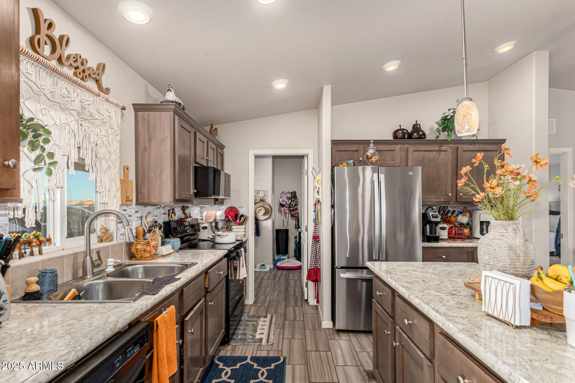 20514 West Narramore Road Buckeye, AZ 85326 - Photo 12 of 31 a kitchen with stainless steel appliances granite countertop a sink refrigerator and microwave