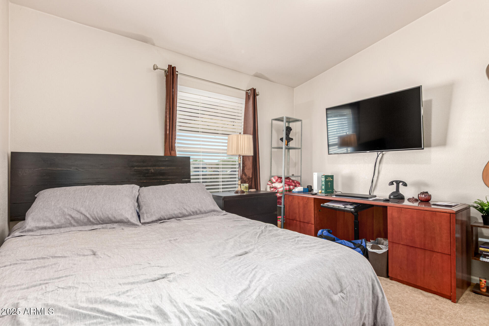 20514 West Narramore Road Buckeye, AZ 85326 - Photo 19 of 31 a bedroom with a bed and a flat screen tv