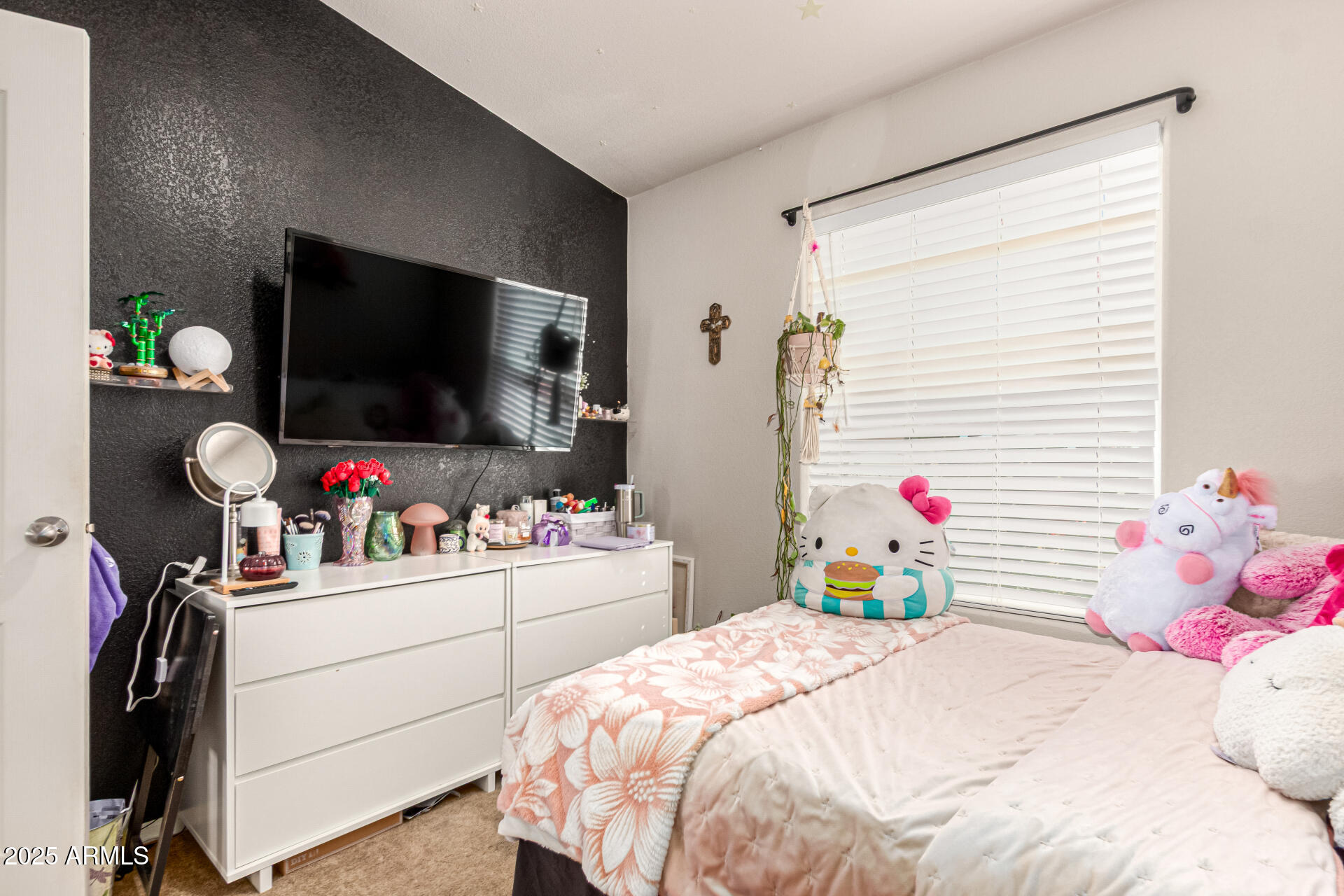20514 West Narramore Road Buckeye, AZ 85326 - Photo 21 of 31 a bedroom with a bed a flat screen tv and a couch