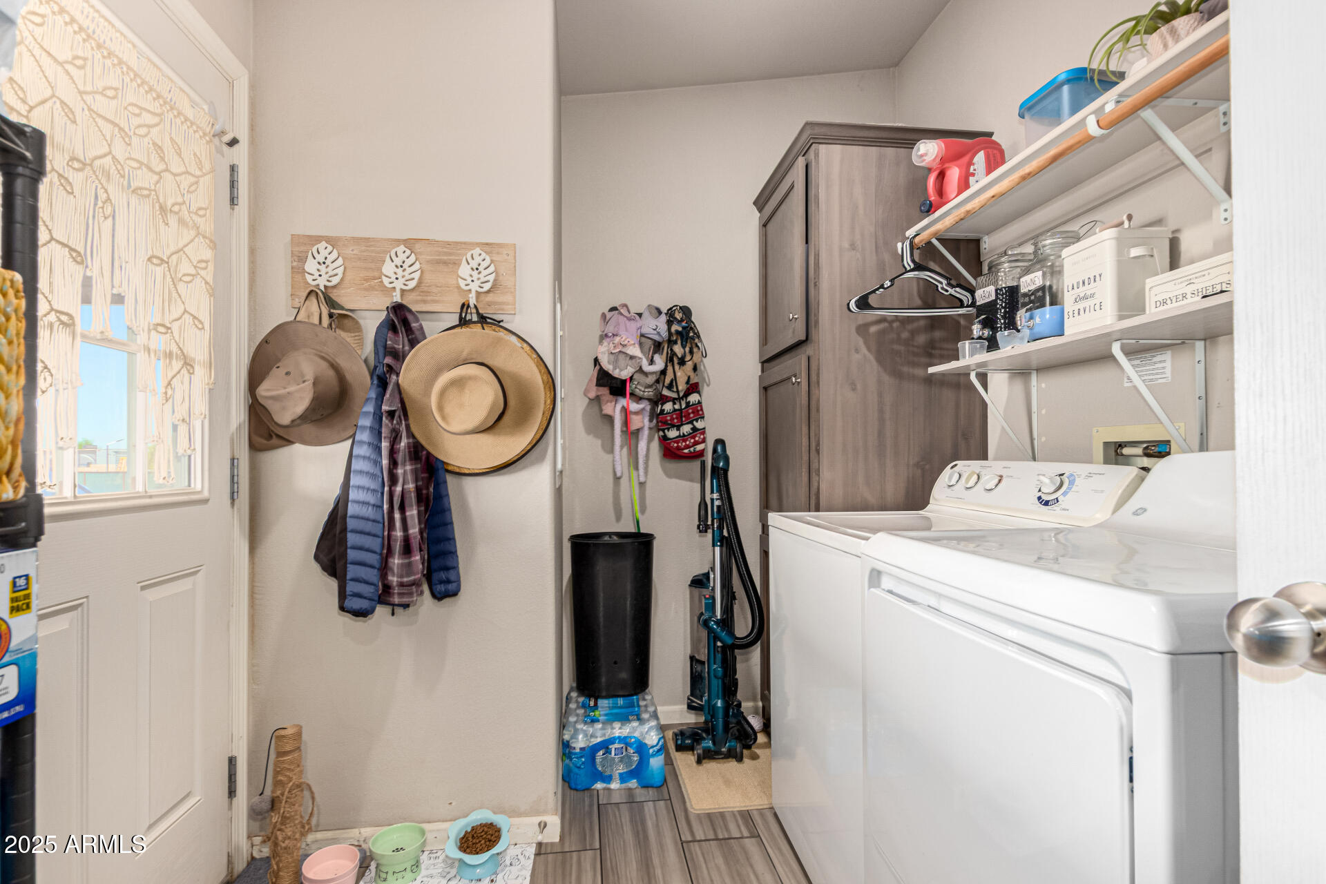 20514 West Narramore Road Buckeye, AZ 85326 - Photo 25 of 31 a view of storage and utility room with washer and dryer
