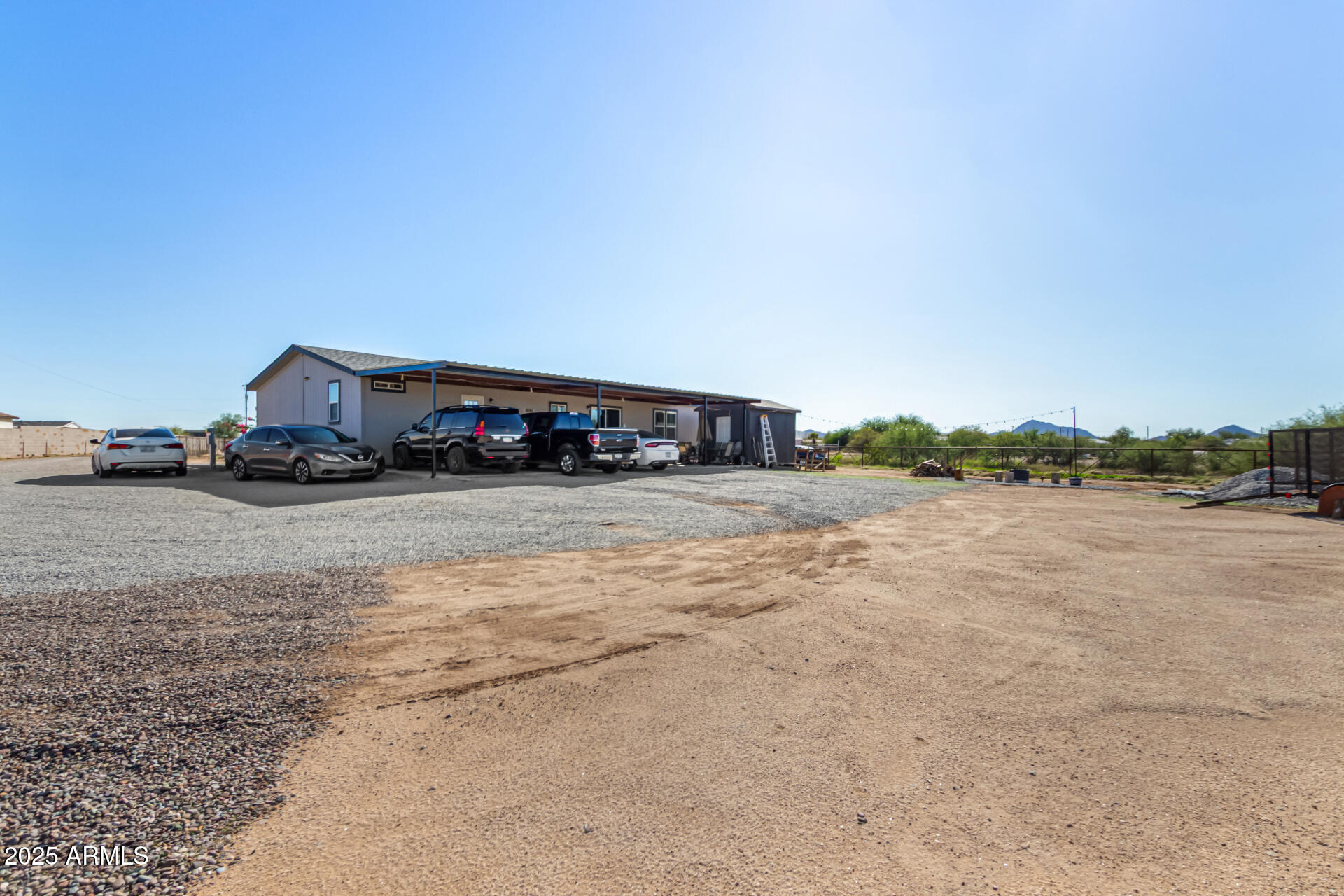 20514 West Narramore Road Buckeye, AZ 85326 - Photo 29 of 31 a car parked on the side of the road