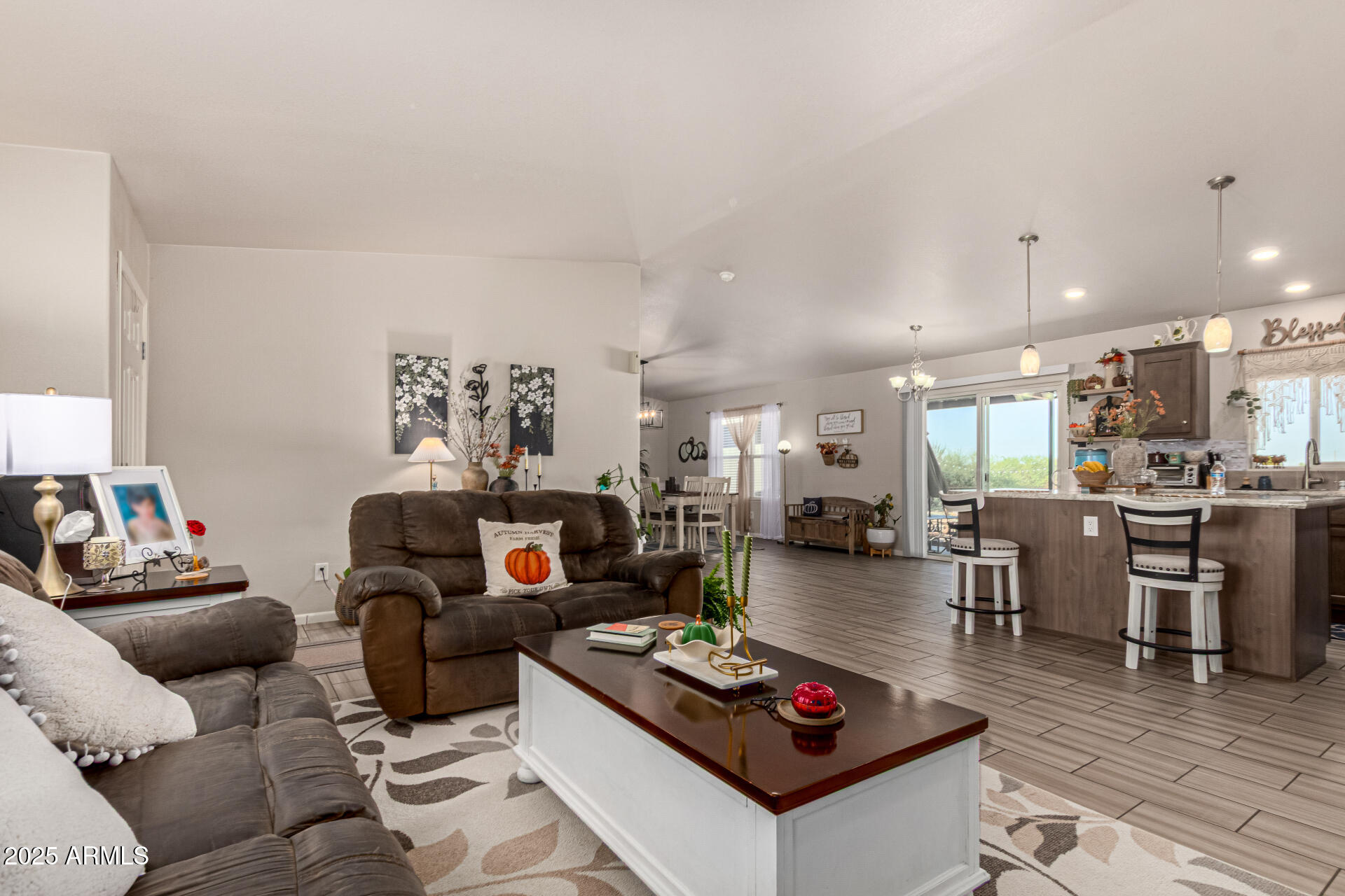 20514 West Narramore Road Buckeye, AZ 85326 - Photo 8 of 31 a living room with furniture and a wooden floor