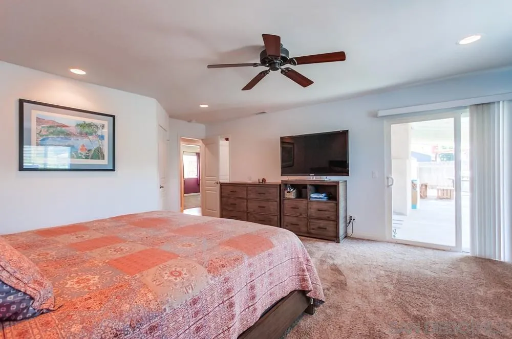 14020 Frame Road Poway, CA 92064 - Photo 15 of 52 a bedroom with a bed and a flat screen tv