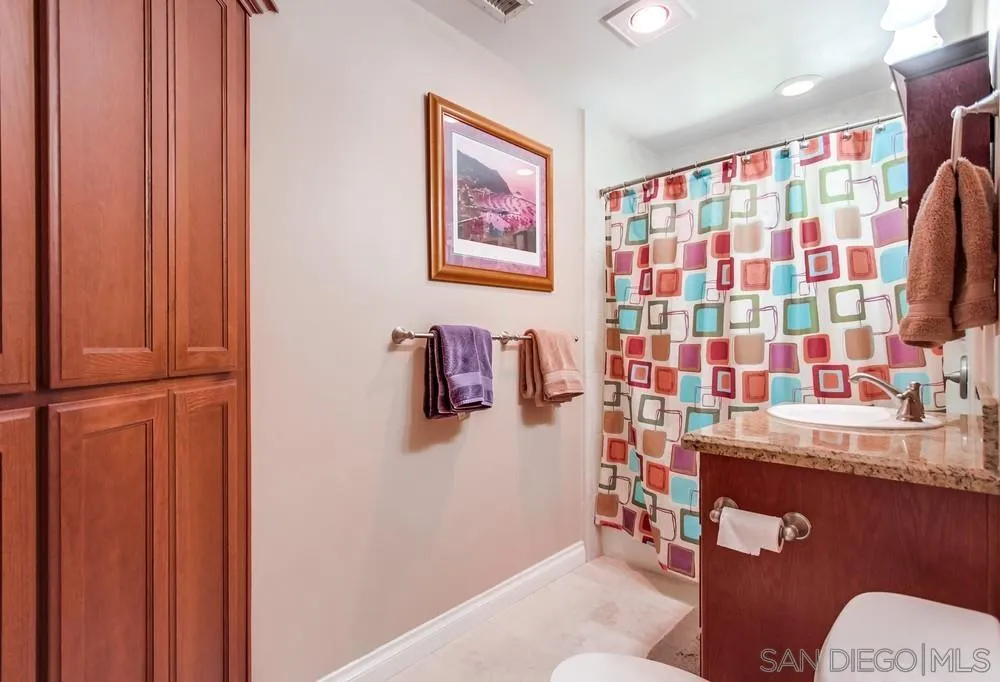 14020 Frame Road Poway, CA 92064 - Photo 17 of 52 a bathroom with a sink toilet and shower