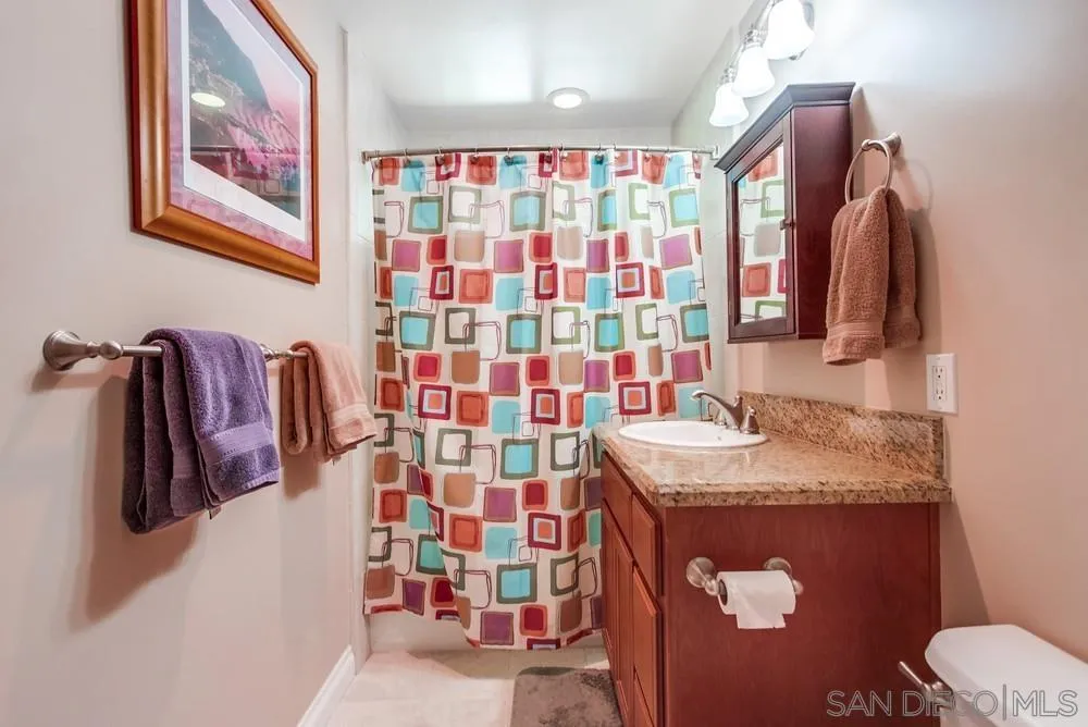 14020 Frame Road Poway, CA 92064 - Photo 18 of 52 a bathroom with a sink toilet and shower