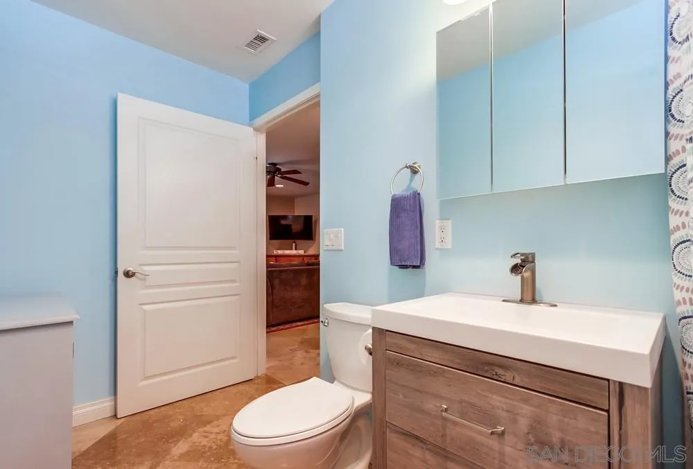 14020 Frame Road Poway, CA 92064 - Photo 29 of 52 a bathroom with a sink a toilet and shower