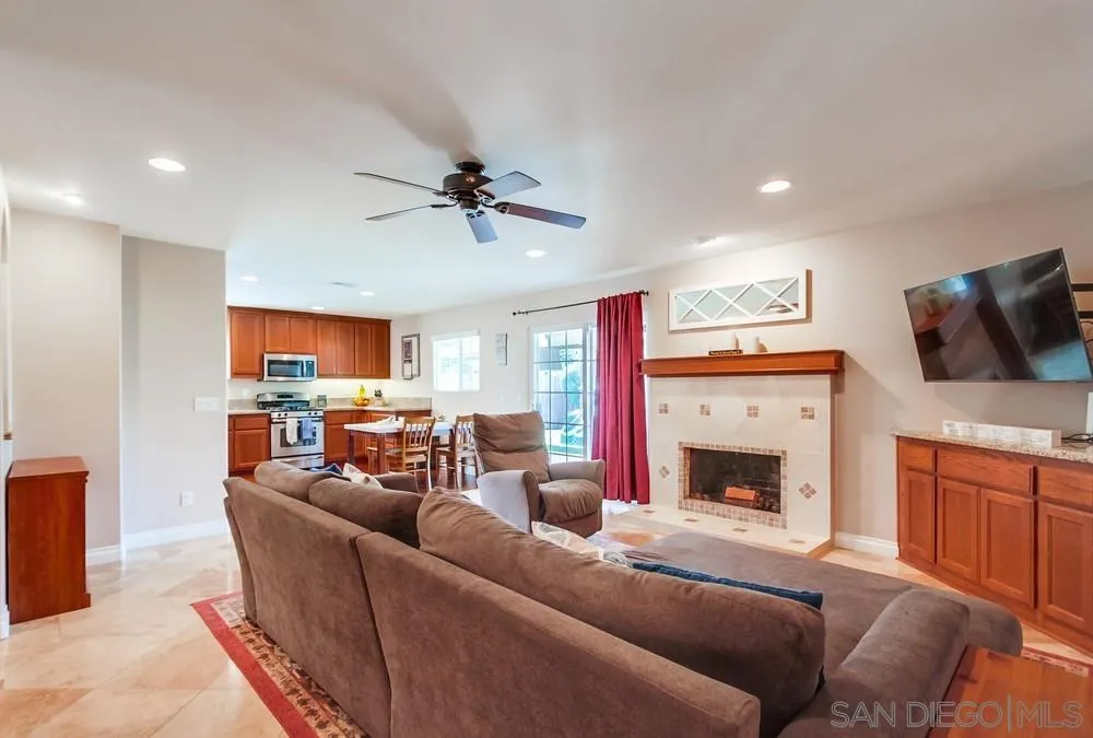 14020 Frame Road Poway, CA 92064 - Photo 3 of 52 a living room with furniture a fireplace and a flat screen tv