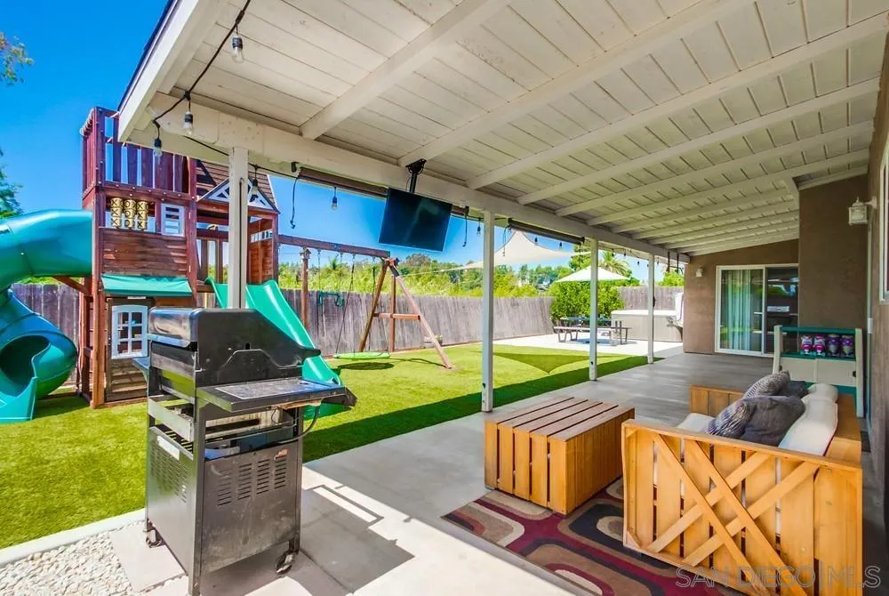 14020 Frame Road Poway, CA 92064 - Photo 38 of 52 a living room with patio furniture and a floor to ceiling window