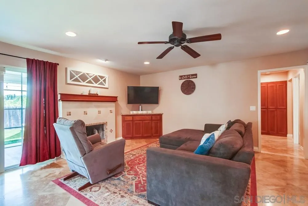 14020 Frame Road Poway, CA 92064 - Photo 4 of 52 a living room with furniture and a fireplace