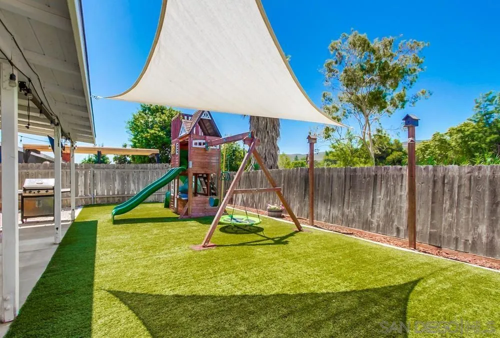 14020 Frame Road Poway, CA 92064 - Photo 50 of 52 a view of a backyard with a slide and potted plants