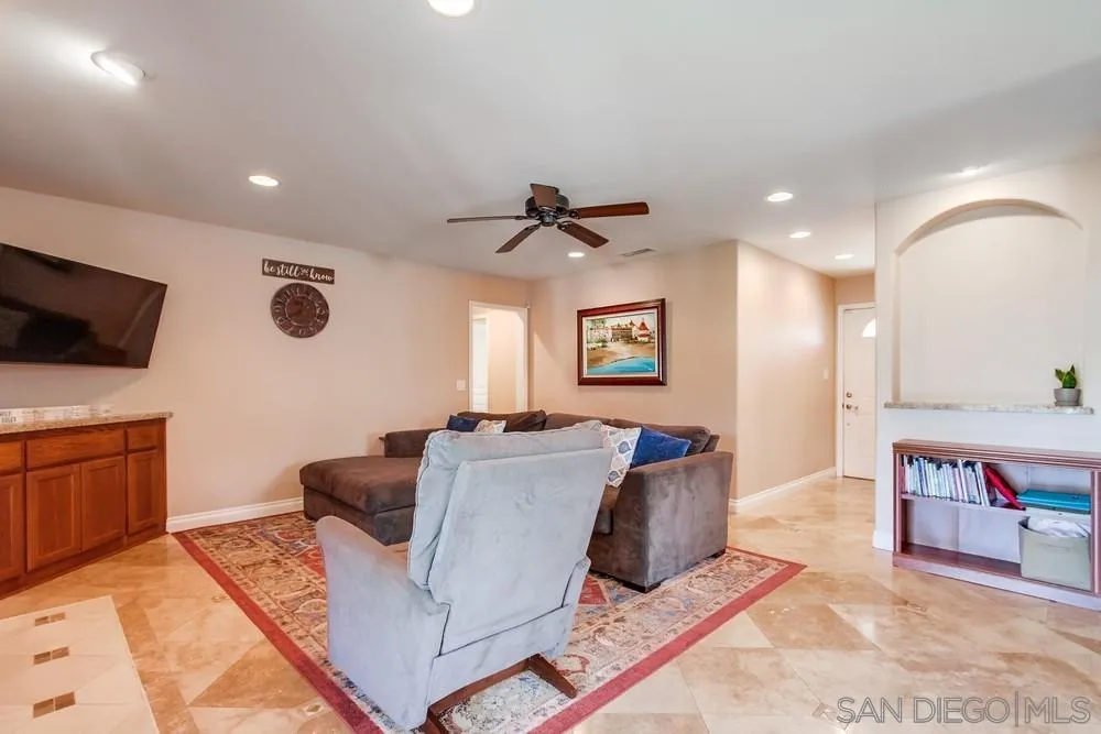 14020 Frame Road Poway, CA 92064 - Photo 5 of 52 a living room with furniture and a flat screen tv