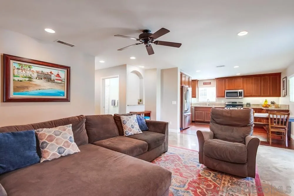 14020 Frame Road Poway, CA 92064 - Photo 6 of 52 a living room with furniture kitchen view and a chandelier