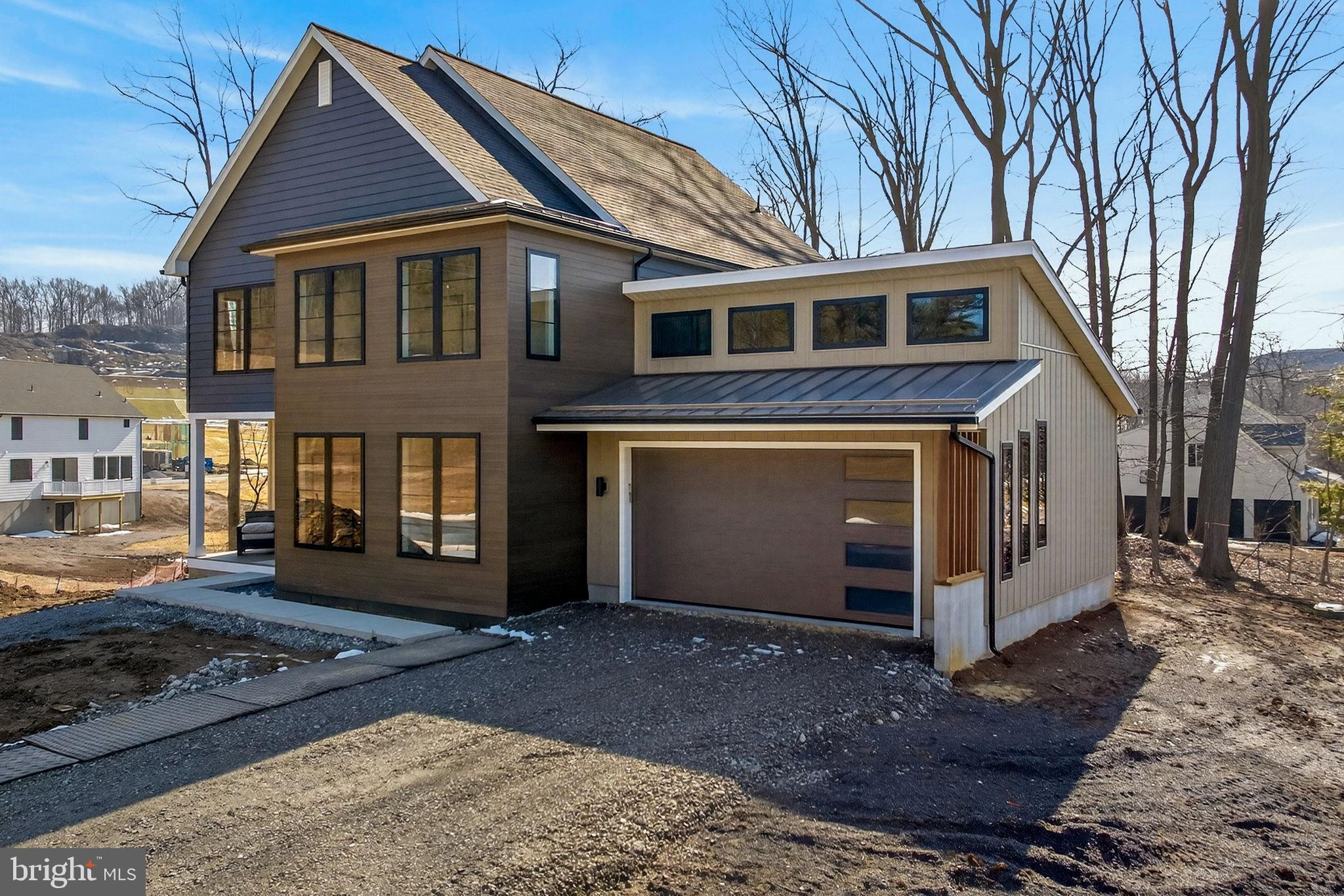 Anvil Model Lot #9 Anvil Model, Unit 9 Womelsdorf, PA 19567 - Photo 2 of 68 Modern home nestled among serene trees.