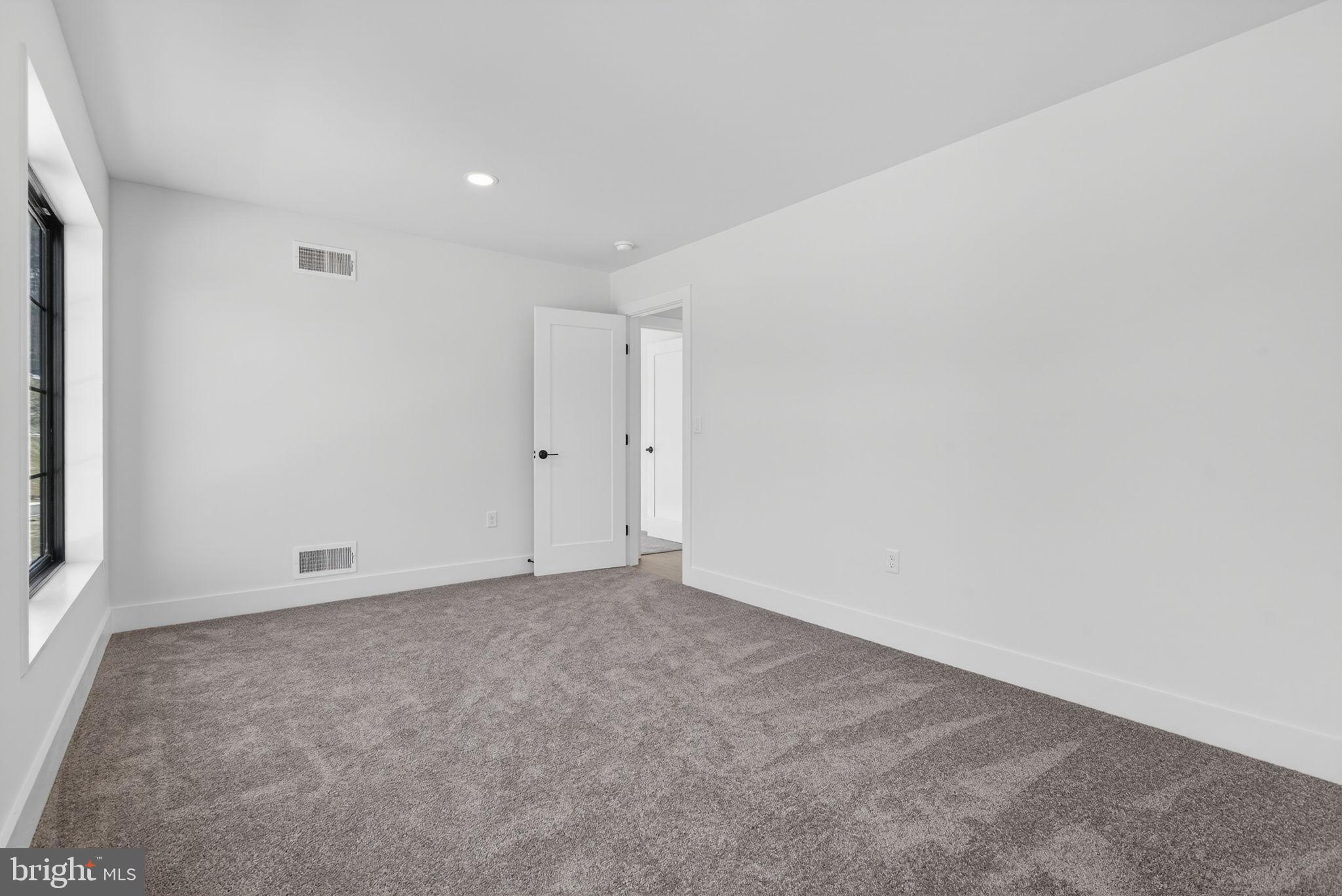 Anvil Model Lot #9 Anvil Model, Unit 9 Womelsdorf, PA 19567 - Photo 58 of 68 Spacious, modern room with soft carpeting.